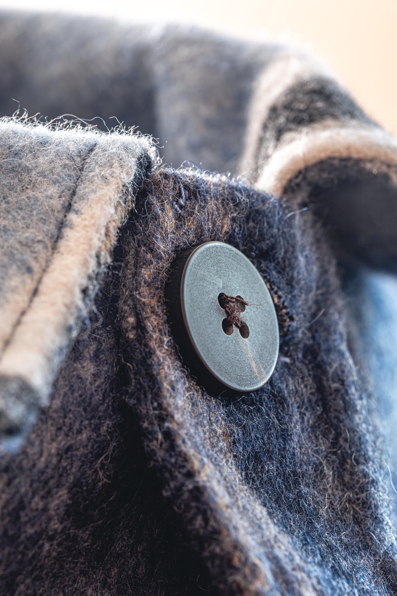 Small embroidered crest on wool jacket
